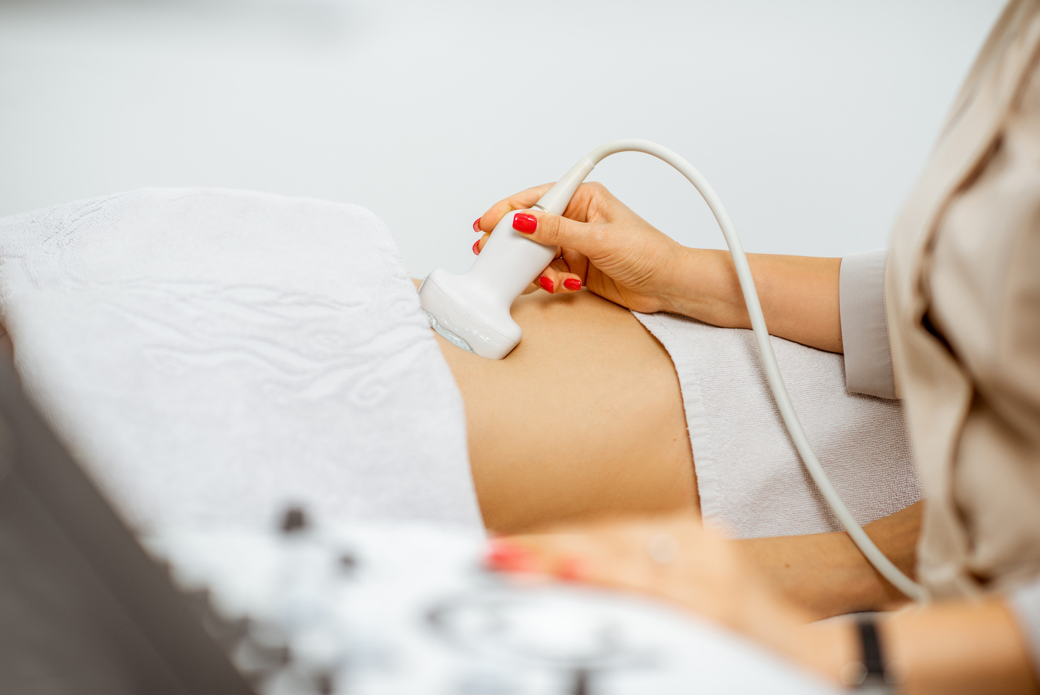 Doctor Performing an Ultrasound Scan on Pregnant Woman